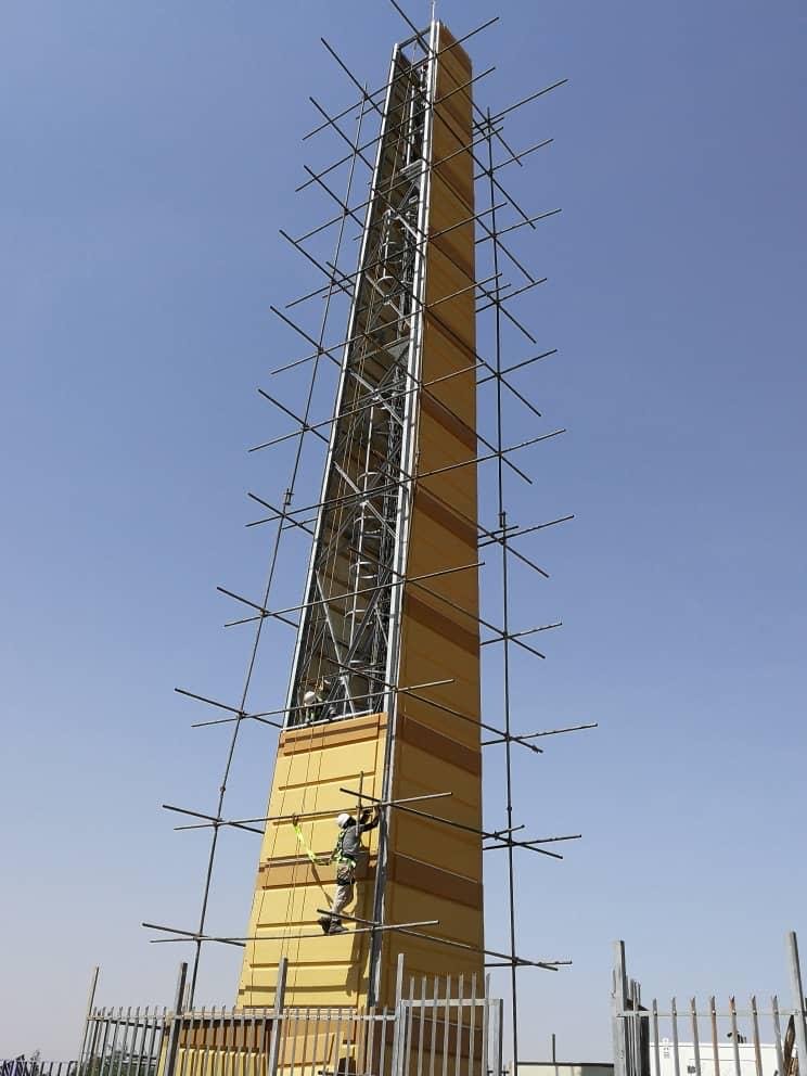 Landmark tower under construction on scaffolding