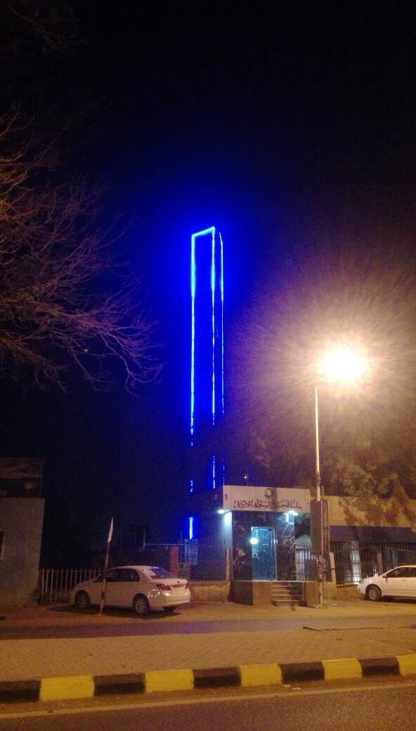 Customized camouflage tower with blue lighting at night, Sudan