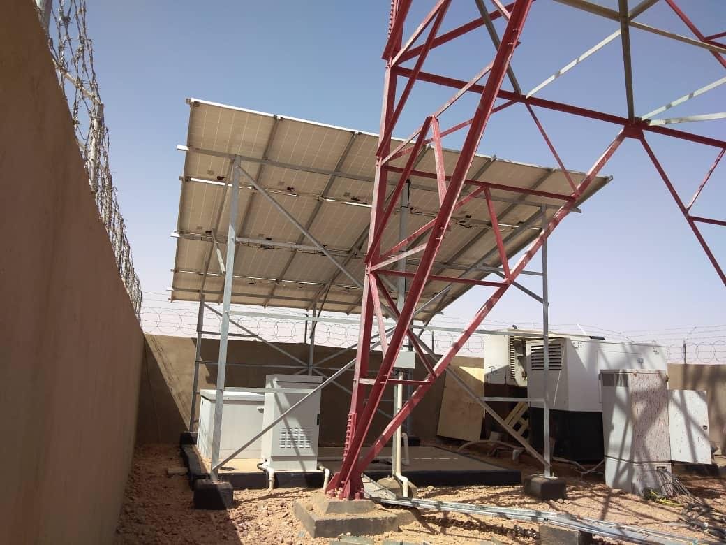 Solar panel structure beside a lattice tower, Sudan