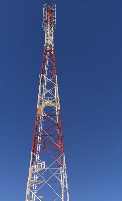 Red and white lattice tower installation, KSA